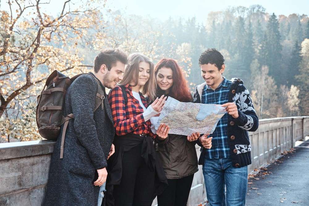 FormatFactorygroup-young-people-are-looking-map-where-they-are-while-walking-autumn-forest-1.jpg