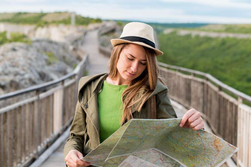 FormatFactoryportrait-young-woman-checking-map.jpg