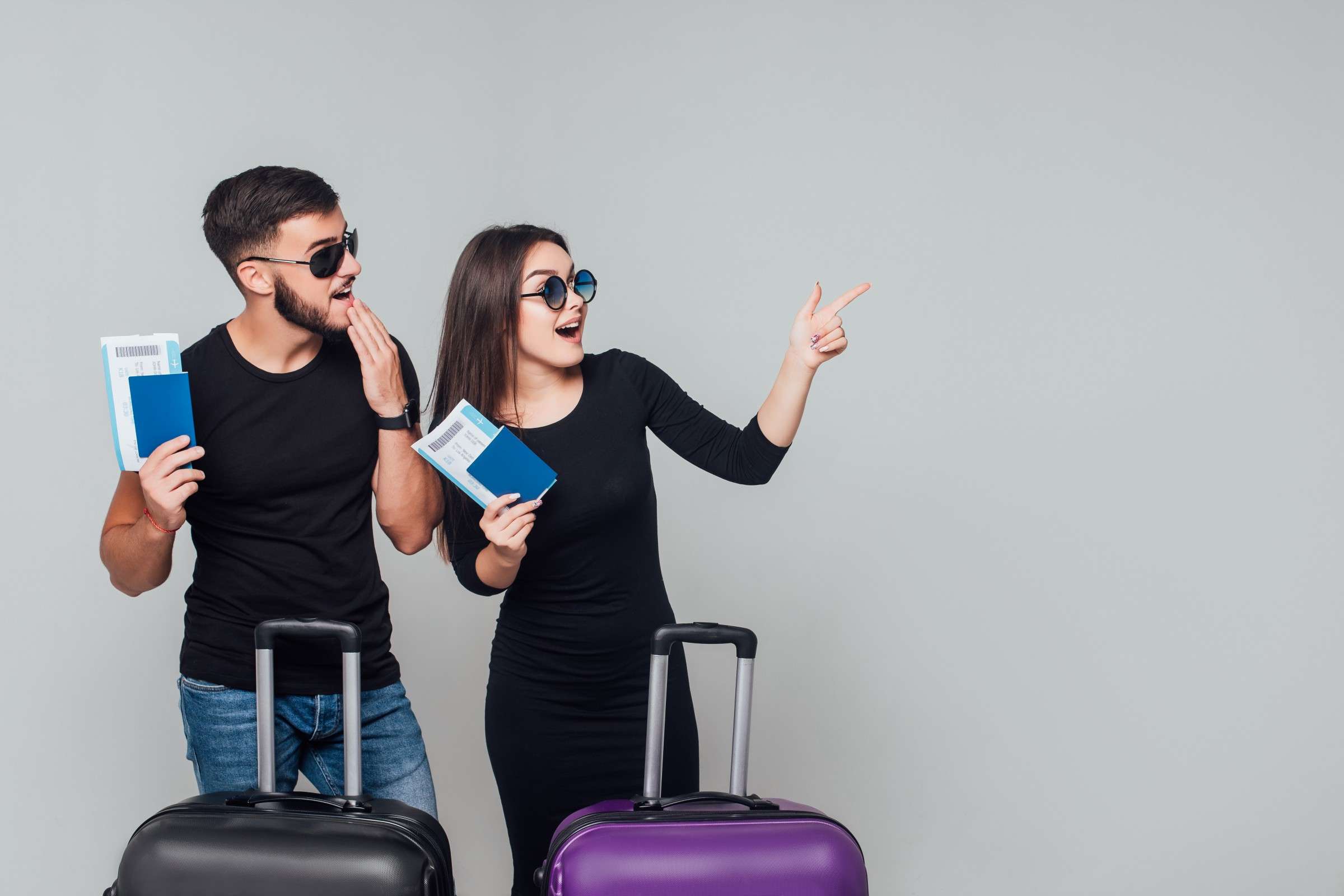 FormatFactorysmiling-young-happy-couple-with-suitcases-ticket-around-isolated-white.jpg