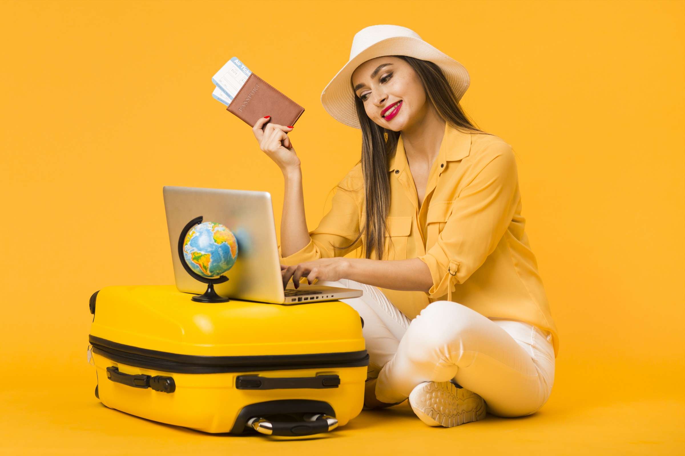 FormatFactorywoman-planning-trip-laptop-while-holding-plane-tickets-passport.jpg