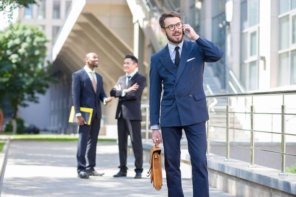 portrait-multi-ethnic-business-team-three-men-standing-against-background-city-foreground-european-man-talking-phone-other-men-is-chinese-african-american.jpg